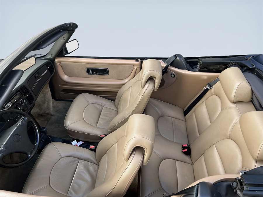 Saab 900 Turbo S Cabriolet 1992 interior view with beige leather seats and dashboard