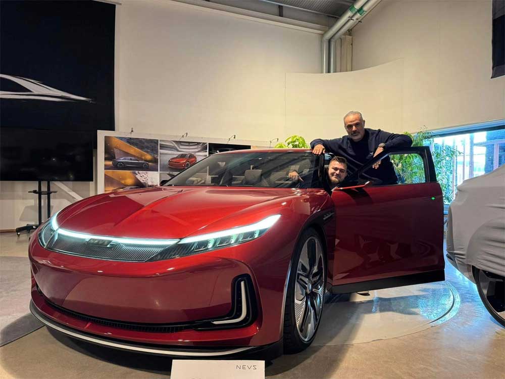 Jihad M. Mohammad, the visionary behind EV Electra, standing proudly beside the Emily GT prototype during his recent visit to the NEVS headquarters in Trollhättan