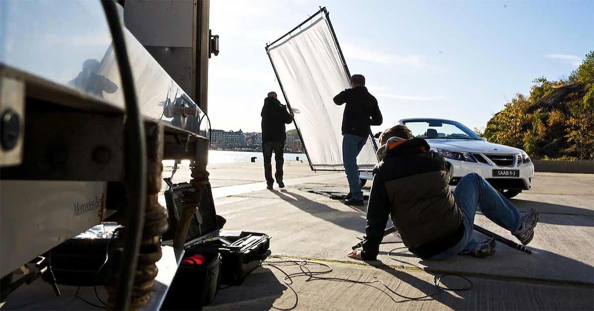 Johan Wedenström in his element, at work, with an iconic car in the focus of his lens, the Saab 9-3 Cabriolet