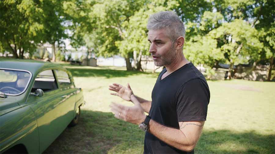 Rich Tomasini presenting his 1967 Saab 96 two-stroke during a walkaround review.
