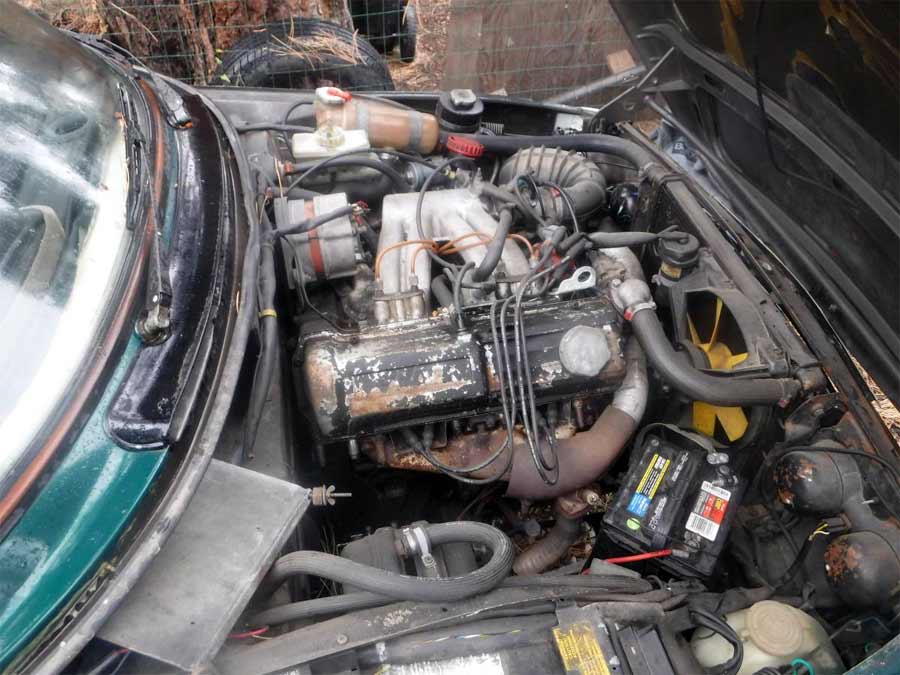 Saab 99 GLE, and, in the engine compartment, everything works in its place