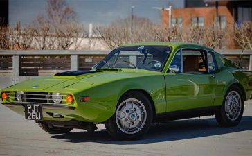1970 SAAB Sonett III in green color with a sleek, sporty design, parked on a sunny day