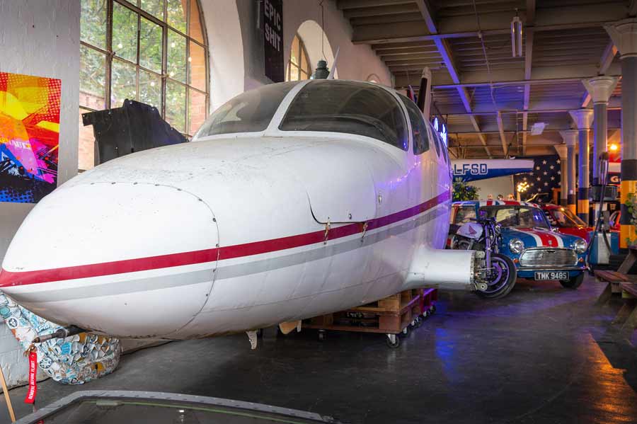 In this fantastic automotive space, there's even room for airplanes, like this Cessna