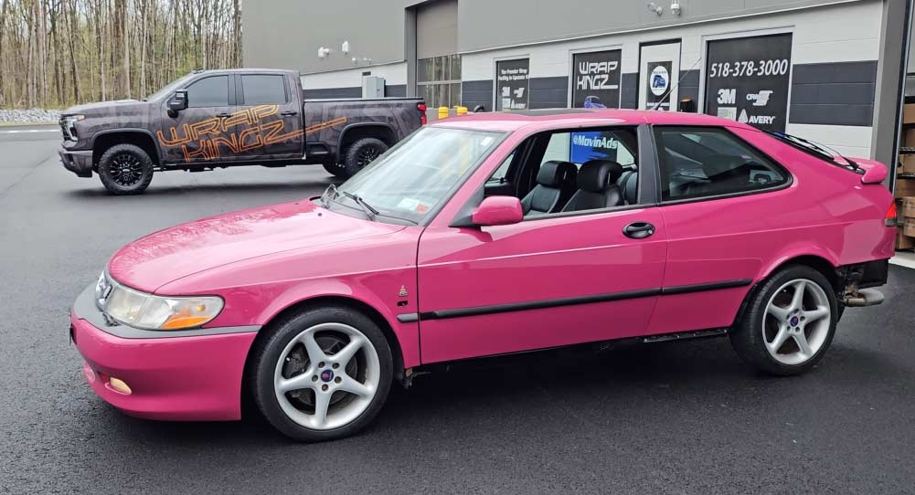 Restored Saab 9-3 Viggen wrapped in Porsche Ruby Star Red after full chassis repair