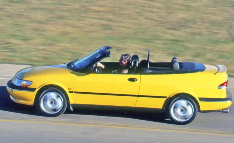 The iconic 1997 Saab 900SE Turbo Convertible in Monte Carlo Yellow—capturing attention and hearts since its Car and Driver debut. (Photo by JEFFREY G. RUSSELL|Car and Driver)