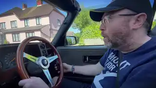 David driving his Saab 900 Convertible again after paralysis