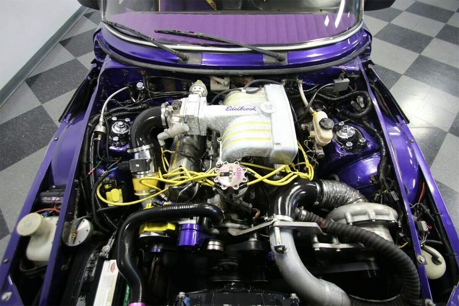 A monstrous Ford V8 under the hood of a Saab
