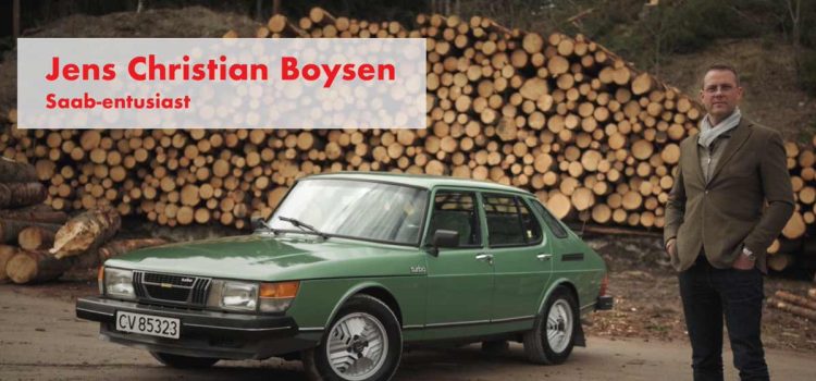 Jens Christian Boysen, the passionate automotive enthusiast, stands proudly beside his cherished 1980 Saab 900 Turbo, a timeless symbol of Nordic design and automotive history.