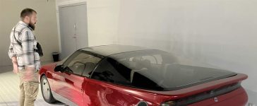 Milija Šćepanović next to a Saab concept model inside the Saab Car Museum during the 50th anniversary Night at the Saab Museum event