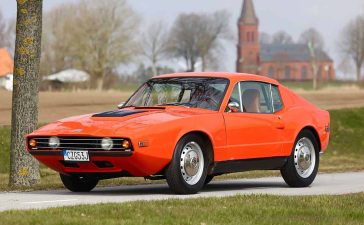 A gleaming Saab Sonett III, Sweden's answer to the Corvette, is now up for auction, showcasing the engineering prowess of Trollhättan. With a V4 engine born from a halved V8, this shining sports car represents Saab's unique take on performance and style