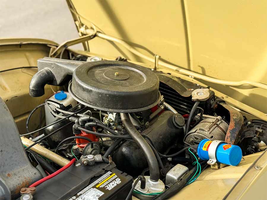 Engine bay of a 1971 Saab 95 Wagon showing the 1.7-liter Ford Taunus V4 with carburetor, ignition components, and front-wheel-drive layout