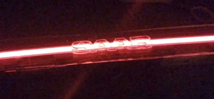 Prototype Saab 9-3 SportCombi LED bar glowing in signature red with illuminated SAAB lettering — a modern continuation of Saab’s design legacy by KM-Tronics.