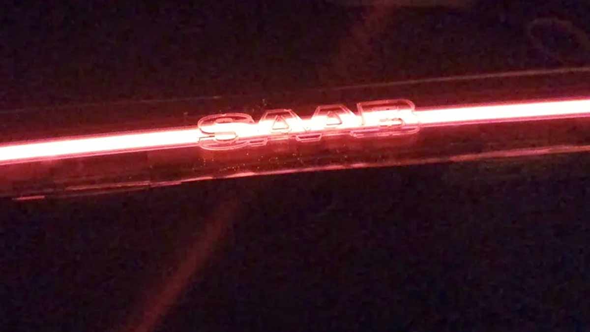 Prototype Saab 9-3 SportCombi LED bar glowing in signature red with illuminated SAAB lettering — a modern continuation of Saab’s design legacy by KM-Tronics.