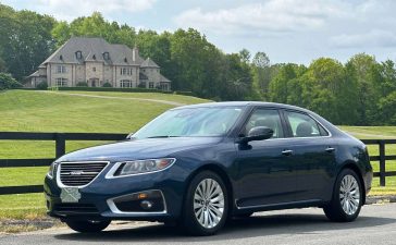 Immerse yourself in automotive elegance - the 2011 Saab 9-5 Aero XWD Turbo, a rare find with just 15k miles, showcasing its stunning Fjord Blue Metallic exterior and timeless design.