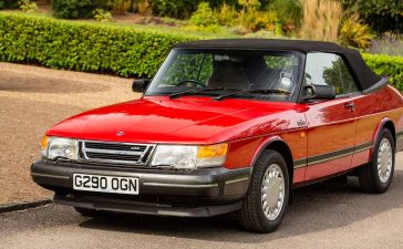 Pristine 1990 Saab 900 Turbo 16 Convertible in radiant red, a classic beauty that recently fetched £33,750 at auction, showcasing its impeccable preservation and low mileage.