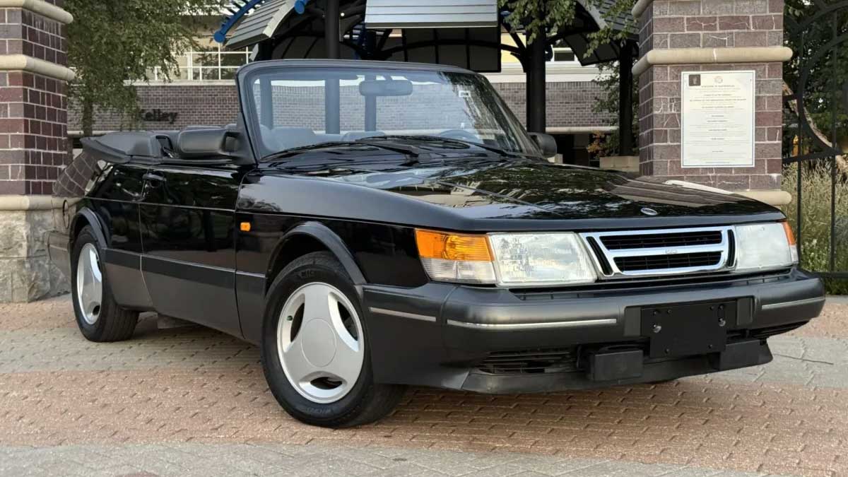 The exact 1988 Saab 900 Turbo SIS Convertible from the video — pristine and poised at auction, just before selling for over $23K.