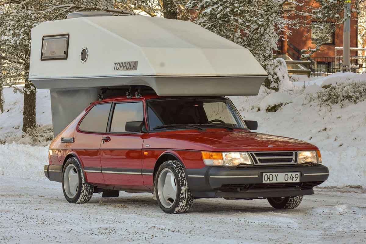 When Saab Owners Took the Road With Them: The Untold Story of Toppola on the 99, 900, and 9000 1 Red Saab 900 fitted with a Toppola camper module parked on a snowy road, highlighting the classic Scandinavian camper setup in winter conditions.