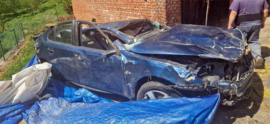 Damaged SAAB 9-3 after a series of violent rollovers on the highway