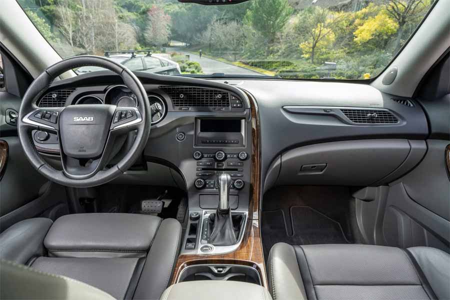 Inside the 2011 Saab 9-4X Premium: A blend of luxury and technology with gray leather upholstery and advanced comfort features