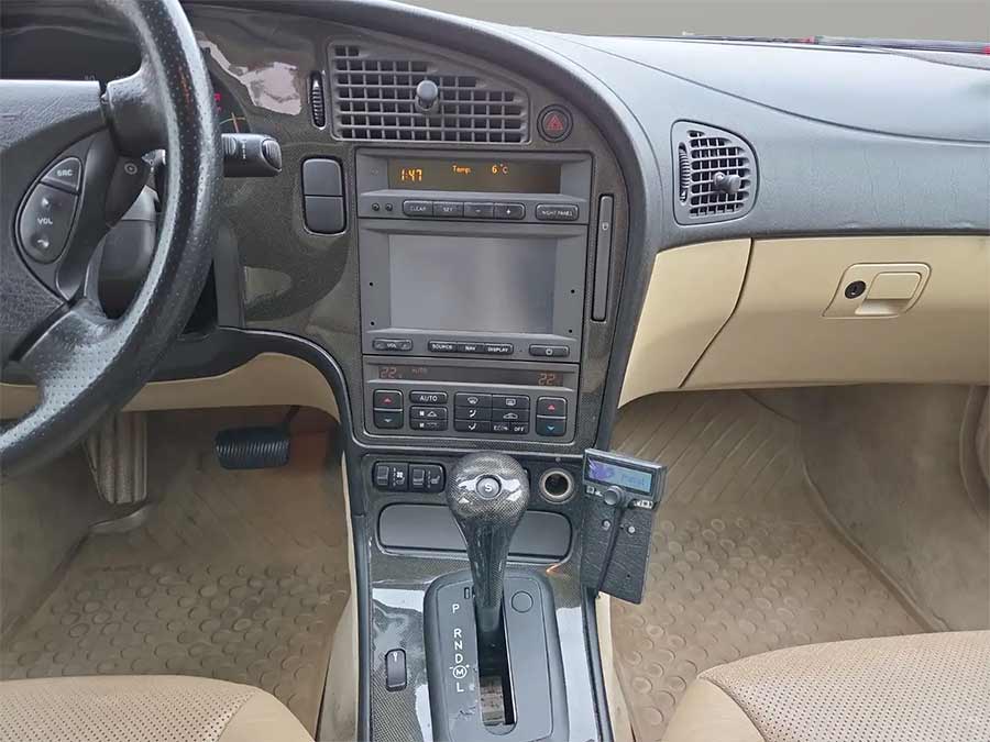 This 440,000 KM Saab 9-5 Aero Wagon Costs Less Than a Set of Tires 4 Factory-installed carbon fiber trim surrounds the automatic shifter and center stack, giving this Saab 9-5 Aero a premium, performance-oriented feel that sets it apart from more modest trims.