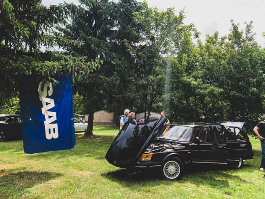 "SAAB campers unite under the open sky, celebrating their shared love for adventure and the iconic Swedish brand