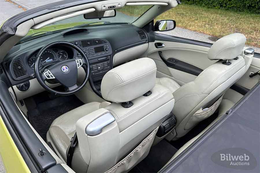 Raw Evolution: The 2004 Saab 9-3 Aero Convertible 2.0T Roars into Collector Territory 3 Original light beige leather interior in exceptional condition—minimal wear, fully functional electronics, and unmistakable Saab cockpit ergonomics preserved after two decades.
