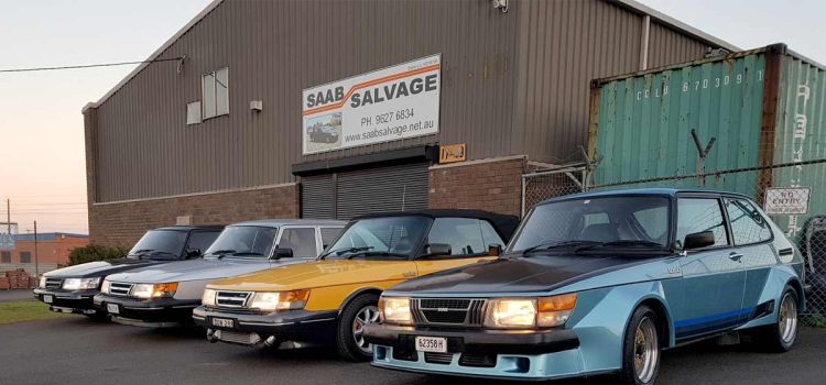 Frontline of Saab classics – Saab 900s lined up outside Saab Salvage headquarters in New South Wales.