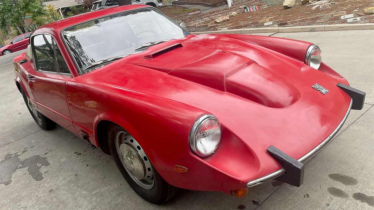 The 1969 Saab Sonett V4 on Bring a Trailer, showing its clamshell hood and signature V4 bulge that marked Saab’s pivot from two-stroke to four-stroke power.