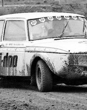 Ture Karlsson sliding his Saab 99 rallycross car through a muddy corner in Sweden