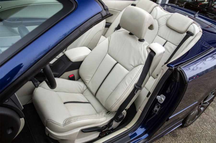 Inside the 2007 SAAB 9-3 Turbo Vector Convertible Special Edition: A harmonious blend of luxury and comfort, with pristine original SAAB leather seats featuring unique striping, complementing the elegantly detailed and driver-focused cabin.