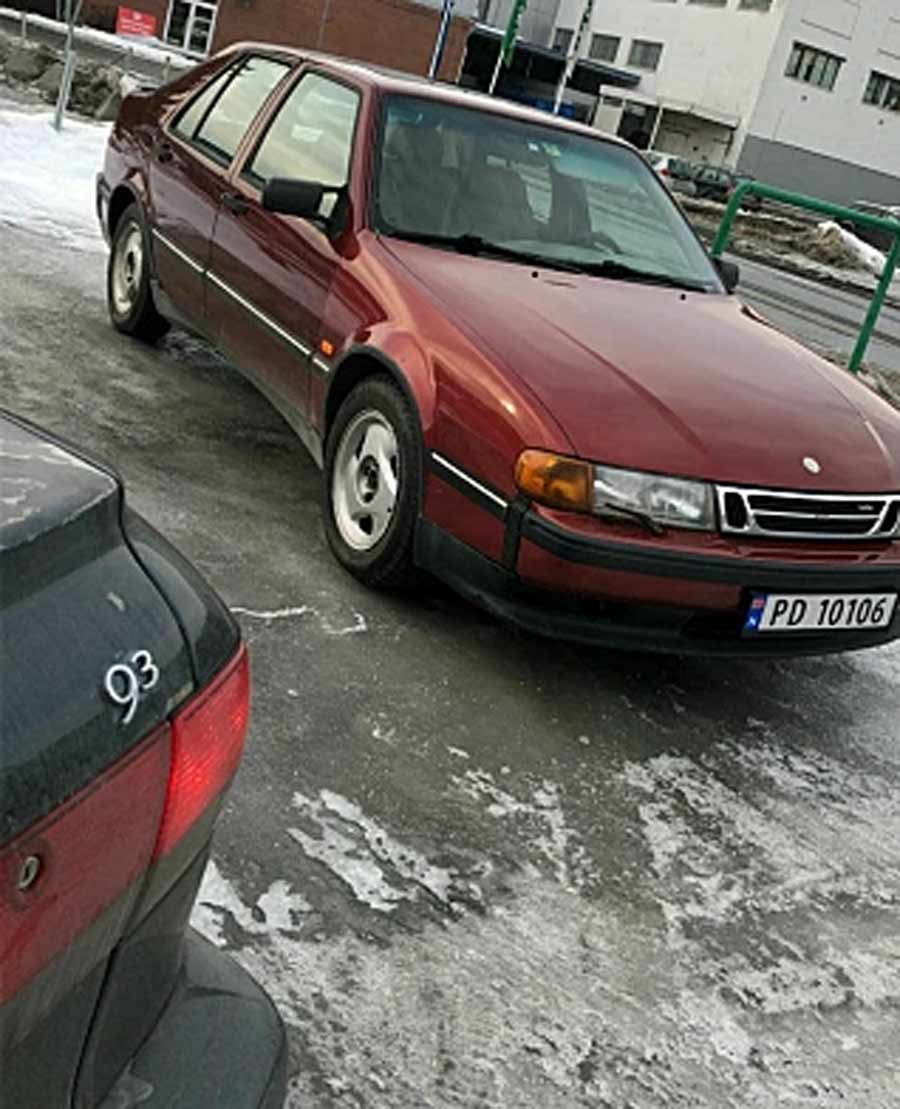 Amongst the sea of red, Arafat's prized possession, the Saab 9000, stands tall. But let's not forget his other treasure, the Saab 93, which we catch a glimpse of here
