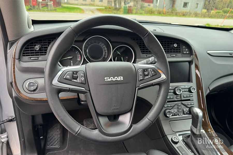 Factory-New Saab 9-4X No. 001 Resurfaces After 14 Years in Hibernation! 3 Saab 9-4X interior preserved since 2012, factory-new dashboard and steering wheel of chassis number 001, photographed by Bilweb Auctions.