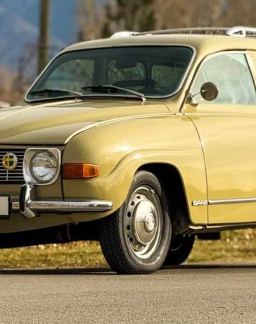 Front three-quarter view of a beige 1971 Saab 95 Wagon with V4 engine, steel wheels, roof rack, and period Swedish plates