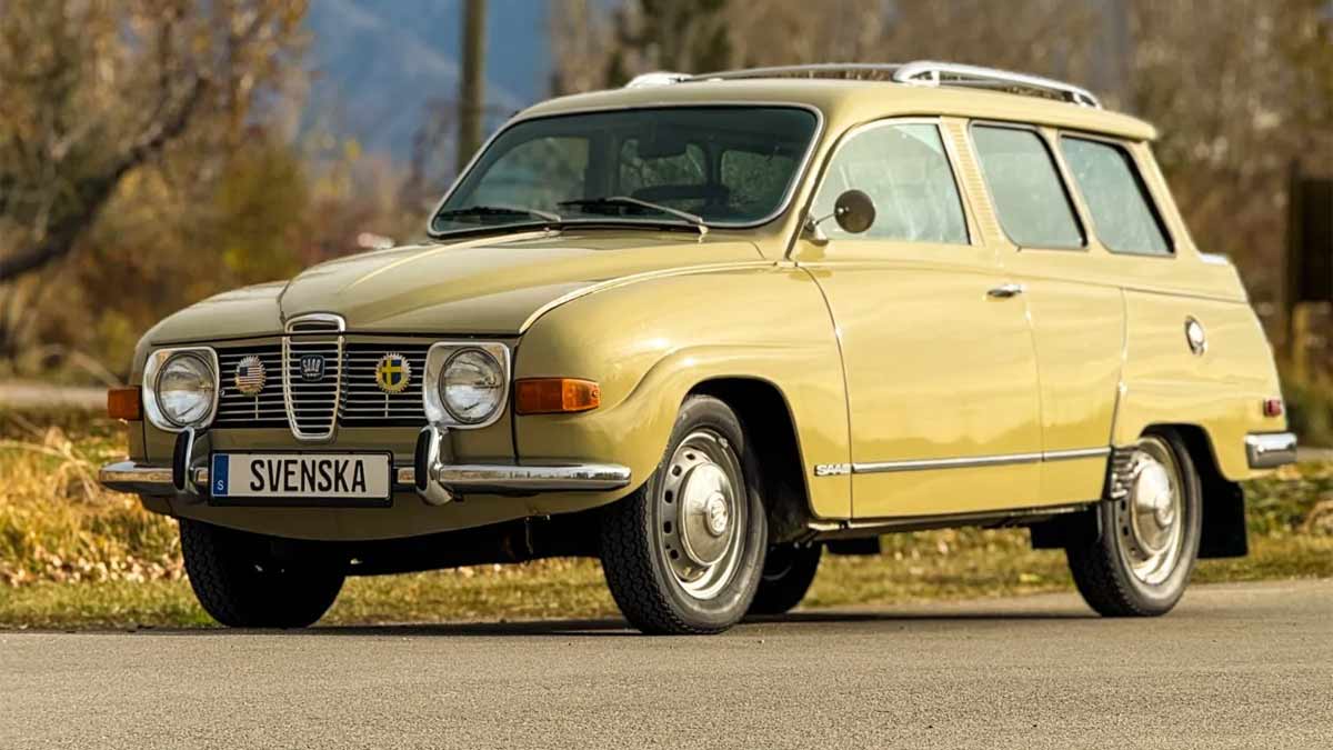 Front three-quarter view of a beige 1971 Saab 95 Wagon with V4 engine, steel wheels, roof rack, and period Swedish plates