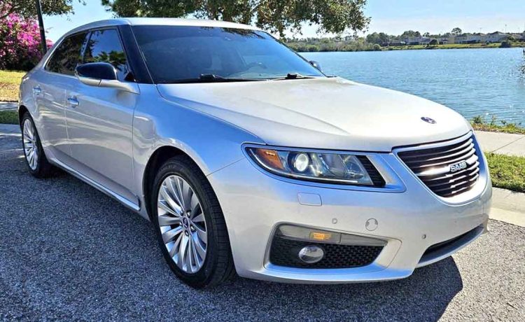 The 2011 Saab 9-5ng AERO TURBO6 in its full glory, showcasing its sleek silver exterior and embodying a legacy of innovation and style.