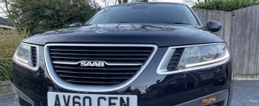 Front View of the 2010 Saab 9-5 Aero: Showcasing its sleek black elegance and the distinctive design that marks Saab's engineering prowess.