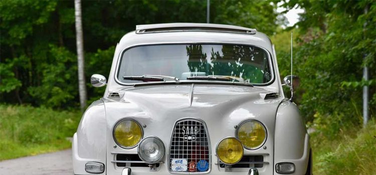 A head-on look at Saab’s rally heritage: the 1964 Saab 96 Sport flaunts its signature triple grille, quad auxiliary lights, and pre-longnose front end—a bold face from the golden era of two-stroke performance.