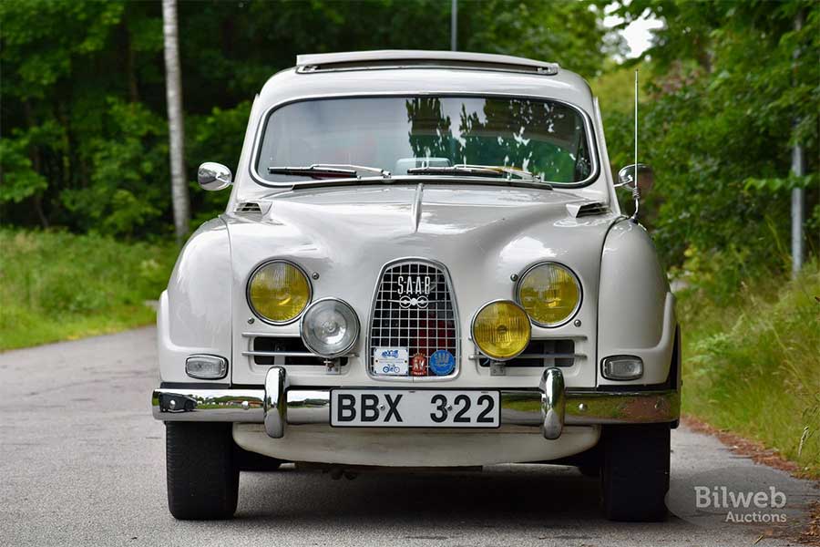 A head-on look at Saab’s rally heritage: the 1964 Saab 96 Sport flaunts its signature triple grille, quad auxiliary lights, and pre-longnose front end—a bold face from the golden era of two-stroke performance.