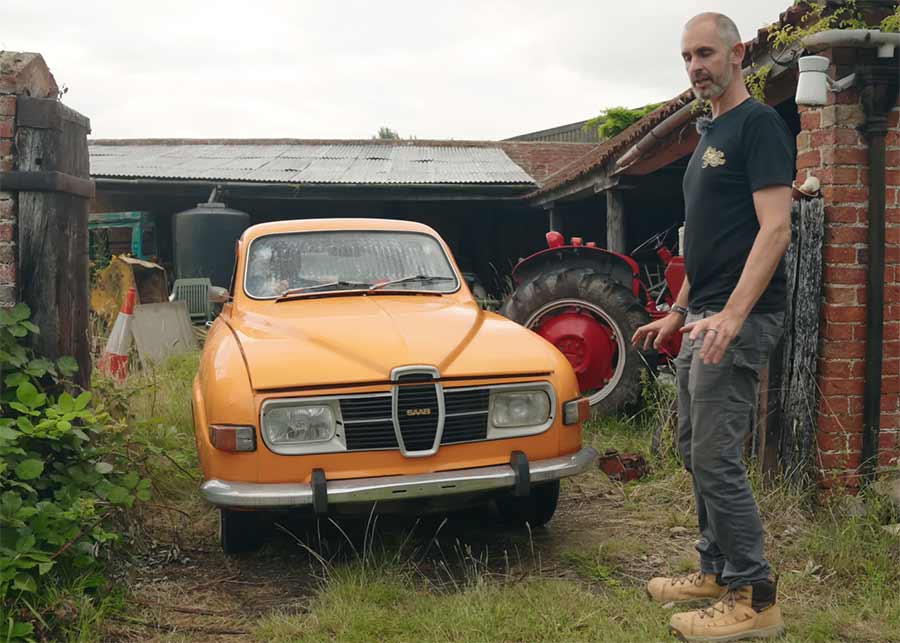 One Owner, 55 Years, One Legend: The Saab 96 Barn Find That Fired Up After 32 Years 2 Bright orange 1973 Saab 96 barn find being rolled out after 32 years, with Jonny Smith from The Late Brake Show beside it.