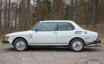 1980 Saab 99 Turbo showcased in a serene forest setting, highlighting its classic design and distinctive turbo features.