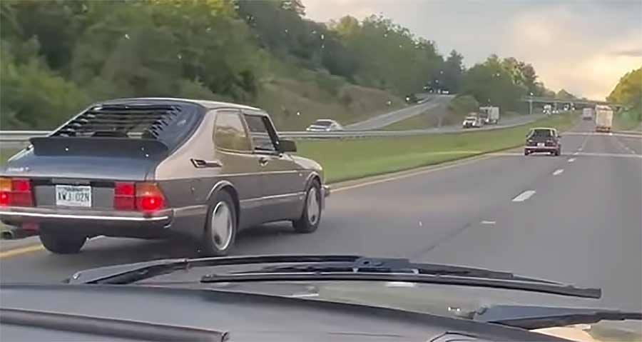 Restored 1986 Saab 900 driving on highway en route to SOC 42 Saab Owners Convention 2025.