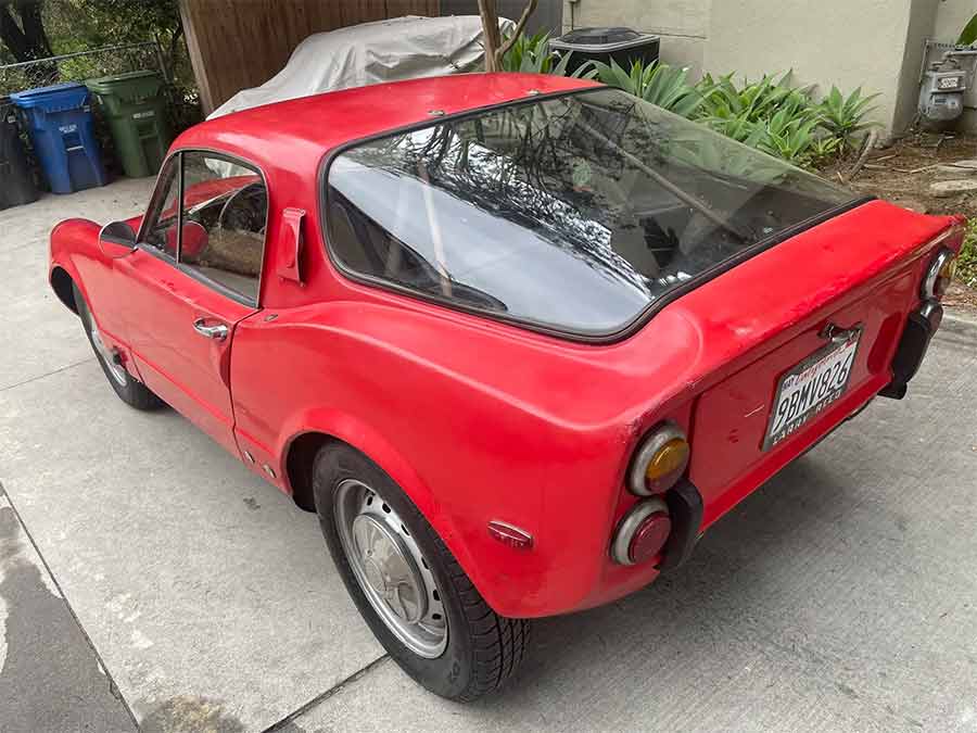 Rear view of the 1969 Saab Sonett V4, showcasing the wraparound glass hatch and minimalist Scandinavian tail design.