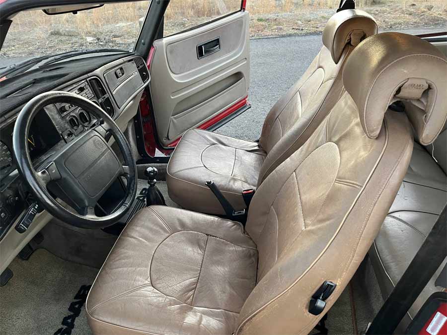 Vintage Elegance with a Touch of Time: The Interior of the 1992 Saab 900 Turbo Showcasing Well-Maintained Leather Seats Awaiting Refreshment