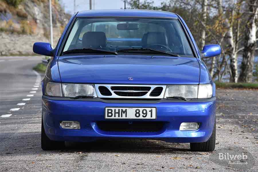 Front view of a 1999 Saab 9-3 Viggen in Lightning Blue on a coastal Swedish road